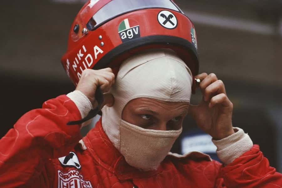 Niki Lauda adjusts his helmet before the fateful 1976 German Grand Prix at Nürburgring, moments before the crash that would change his life and F1 safety.