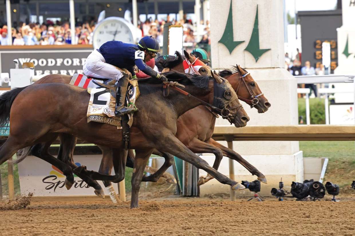 Mystik Dan, ridden by jockey Brian J. Hernandez Jr., crosses the finish line a nose ahead of Sierra Leone and Forever Young to win the 2024 Kentucky Derby at Churchill Downs in Louisville on Saturday.