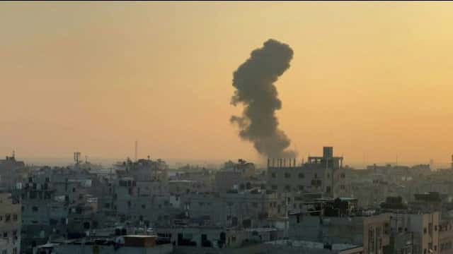 Smoke billows on the horizon after an Israeli airstrike in Rafah in the southern Gaza Strip